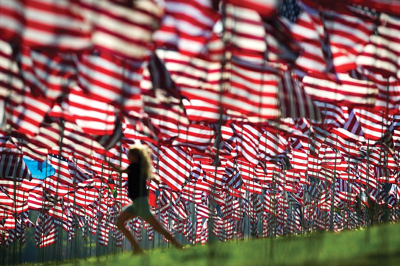 Callie Cirulnick, 10, visits Pepperdine University's annual display of flags Monday in Malibu, Calif. The flags are in honor of the victims of the Sept. 11, 2001, terrorist attacks. Nearly 3,000 people died.