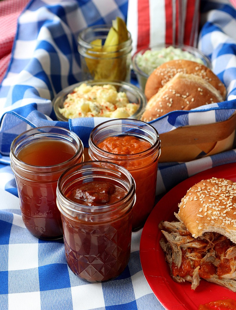 A selection of homemade barbecue sauces: Texas barbecue sauce, apple-bourbon barbecue sauce and Carolina barbeque sauce. (Hillary Levin/St. Louis Post-Dispatch/TNS) 