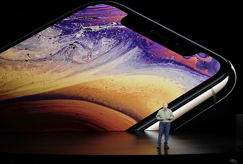 Phil Schiller, Apple's senior vice president of worldwide marketing, speaks about the Apple iPhone XS at the Steve Jobs Theater during an event to announce new Apple products Wednesday, Sept. 12, 2018, in Cupertino, Calif. (AP Photo/Marcio Jose Sanchez)