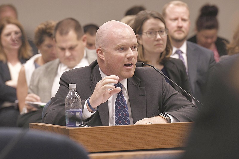 In this Sept. 11, 2018 photo, Rep. Travis Fitzwater introduces a bill during a meeting of the Workforce Development Committee of Missouri House of Representatives.