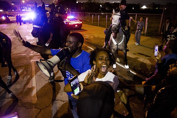 Protesters angered by Dallas police shooting bring meeting to a halt