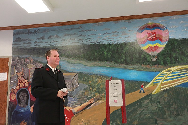 Major David Feeser, the commander of The Salvation Army, talks about the importance of the mural and the vision of The Salvation Army on Wednesday at the Center of Hope Homeless Shelter in Texarkana, Ark. The mural that the Fine Arts Club at the University of Arkansas-Texarkana painted took more than six months to complete at the Center of Hope. The mural was unveiled to the public Wednesday.