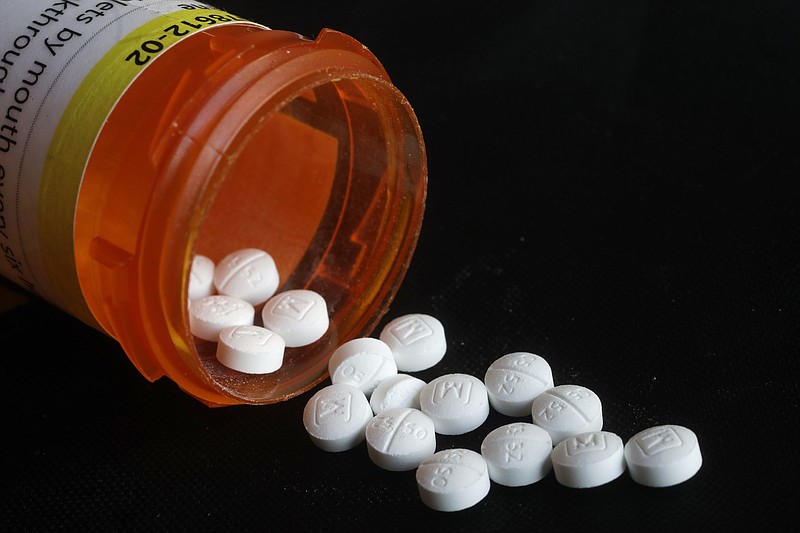 This Aug. 29, 2018 photo shows an arrangement of prescription Oxycodone pills in New York.  (AP Photo/Mark Lennihan)