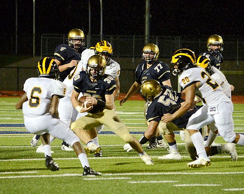 Helias running back Blake Veltrop looks for yardage during last Friday night's game against the Vianney Golden Griffins at Ray Hentges Stadium.