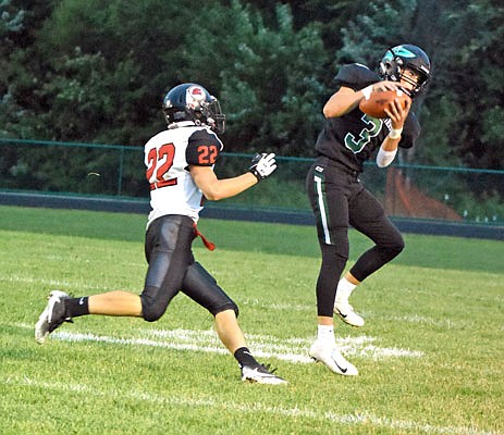 North Callaway senior wide receiver Dawson Wright makes a catch behind Clopton/Elsberry defensive back Eddie Bonstell during the Thunderbirds' 47-0 rout of the IndianHawks last Friday night in Kingdom City.