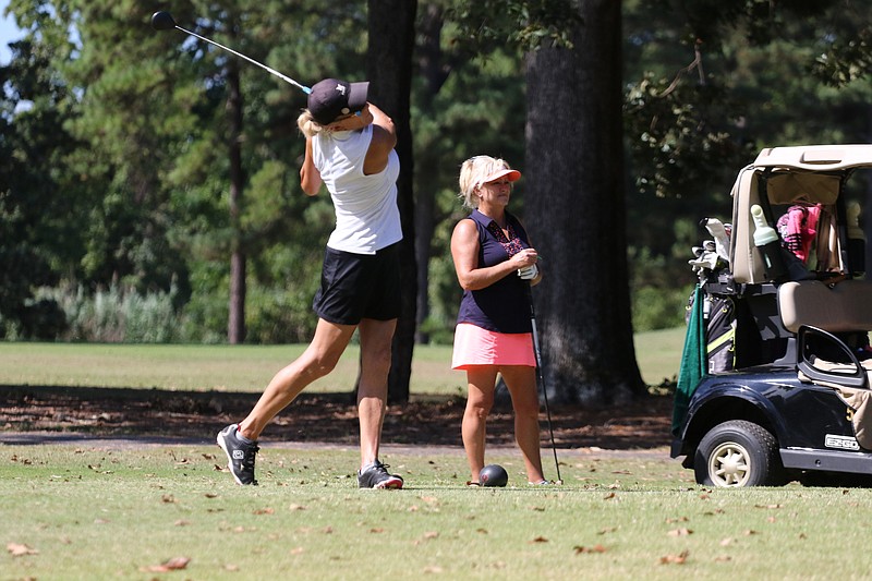 Kathy Davis tees off at the first hole in the final round of the Twice as Nice invitational golf tournament Thursday at Texarkana Country Club in Texarkana, Ark.