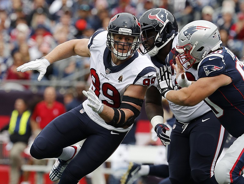 In this Sunday, Sept. 9, 2018, file photo, Houston Texans' J.J. Watt rushes during an NFL football game against the New England Patriots at Gillette Stadium in Foxborough, Mass. Watt got better as the day went on his first game since breaking his leg last October. After getting through that game, the three-time Defensive Player of the Year is looking to make more of an impact this week when the Texans visit Tennessee.  (Winslow Townson/AP Images for Panini, File)