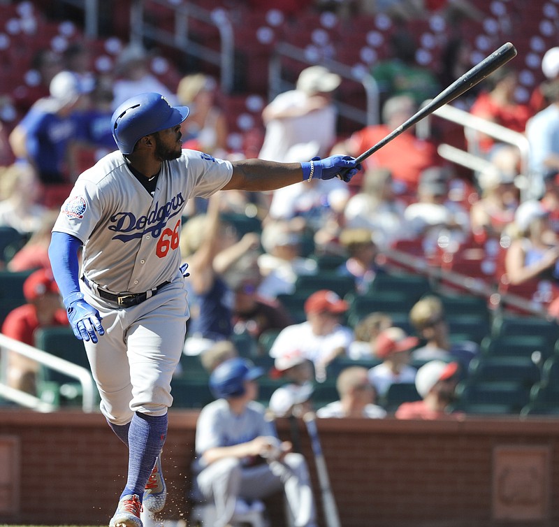 Los Angeles Dodgers' Yasiel Puig (66) watches his third home run of the game a three-run homer against the St. Louis Cardinals in the eighth inning of a baseball game, Saturday, Sept. 15, 2018, at Busch Stadium in St. Louis. (AP Photo/Bill Boyce)