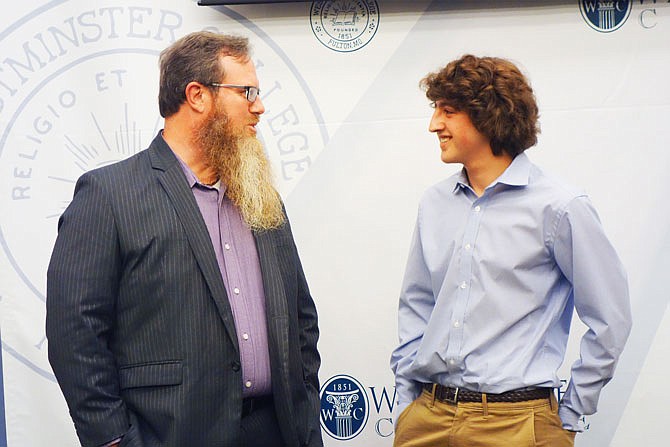 After speaking at Westminster College's Hancock Symposium, Gabe Fleisher, right, chats with political science professor Tobias Gibson. Gibson has subscribed to the 16-year-old's political news email blast since 2012 and is a big fan.