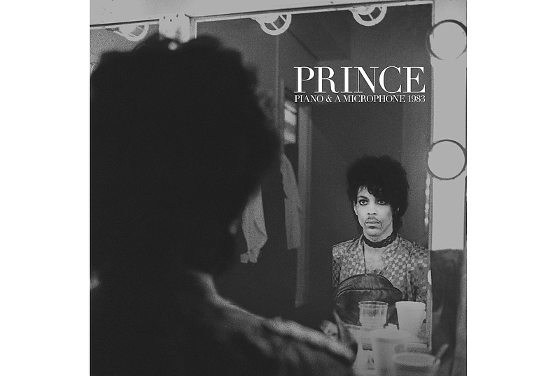 This cover image released by Warner Bros. Records shows “Piano & A Microphone 1983,” a 35-year-old cassette Prince recorded of himself playing piano and singing at his home studio in Chanhassen, Minnesota. The album comes out on CD, vinyl and digital formats on Friday. (Warner Bros. Records via AP)