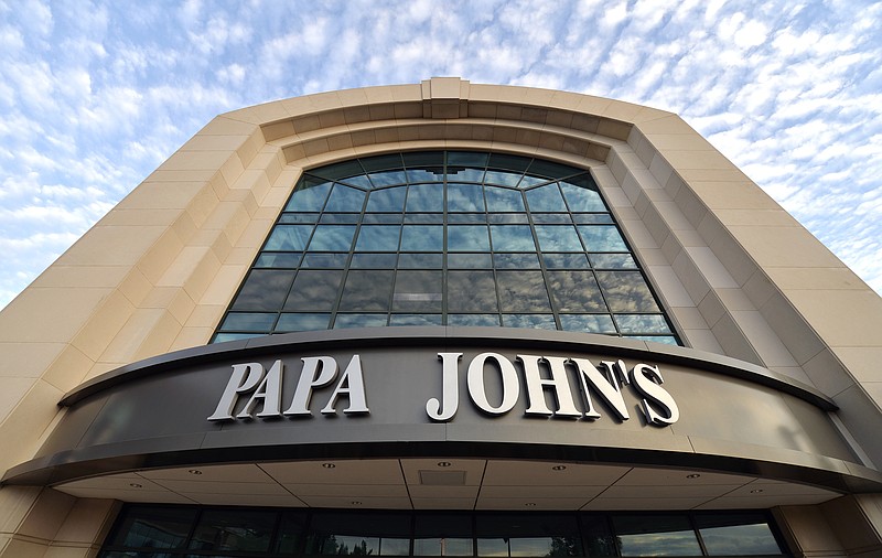 FILE - This July 17, 2018, file photo, shows the corporate headquarters of Papa John's pizza located on their campus, in Louisville, Ky.  Papa John’s, which wants to distance itself from famous founder John Schnatter, is releasing new ads Tuesday, Sept. 18, that replaces him with a diverse group of franchisees.(AP Photo/Timothy D. Easley, File)