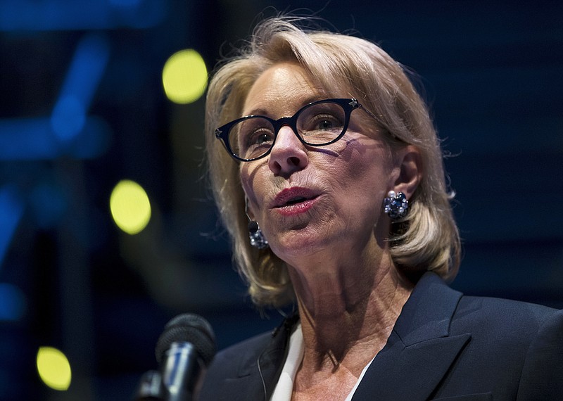 Education Secretary Betsy DeVos speaks during a student town hall at National Constitution Center in Philadelphia, Monday, Sept. 17, 2018. A federal court has handed another victory to students suing Education Secretary Betsy DeVos’ over her efforts to dismantle protections against fraud by for-profit colleges. The U.S. District Court for the District of Columbia ruled late Monday that DeVos’ move to delay an Obama-era regulation boosting those protections must be annulled. At the same time, the court put that very ruling on hold for 30 days, giving the Education Department and another party to the case a chance to respond.  (AP Photo/Matt Rourke)