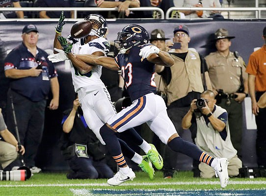 Seahawks wide receiver Tyler Lockett makes a touchdown reception against Chicago Bears defensive back Kyle Fuller during the second half of Monday night's game in Chicago.