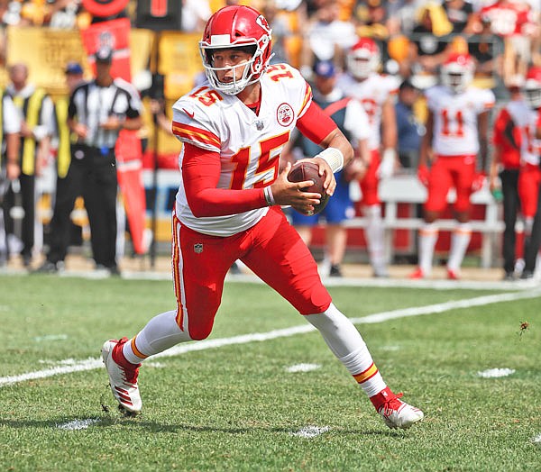 Chiefs quarterback Patrick Mahomes scrambles against the Steelers in the first half of Sunday afternoon's game in Pittsburgh.