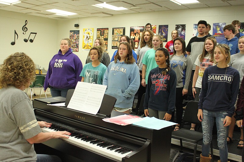 <p>Democrat photo/Liz Morales</p><p>Michele Bilyeu accompanies the California High School mixed choir on piano as students practice a selection to be played at the Sept. 23 fall concert.</p>