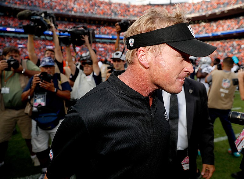 Oakland Raiders head coach Jon Gruden leaves the field after an NFL football game against the Denver Broncos, Sunday, Sept. 16, 2018, in Denver. The Broncos won 20-19. (AP Photo/David Zalubowski)