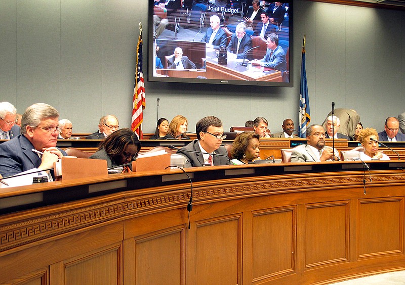 Members of the Joint Legislative Committee on the Budget listen to the details of a new management deal for the north Louisiana safety-net hospitals, Tuesday, Sept. 18, 2018, in Baton Rouge, La. (AP Photo/Melinda Deslatte)