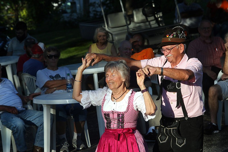 Mel and Pat Propst dance Friday, Sept. 23, 2016, during the first day of Jefferson City's 16th Annual Oktoberfest on Dunklin Street.