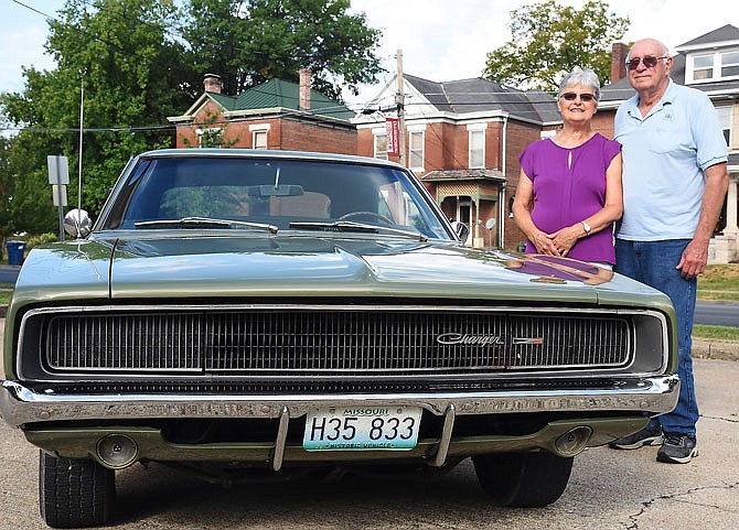 Cathy and Virgil Borgmeyer pose in front of their 1969 Dodge Charger, which will be featured in the upcoming Mid-Mo Old Car Club Round-Up and Show. 