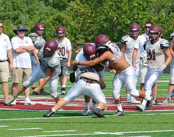 The School of the Osage Indians go through drills during a recent practice session at the school.