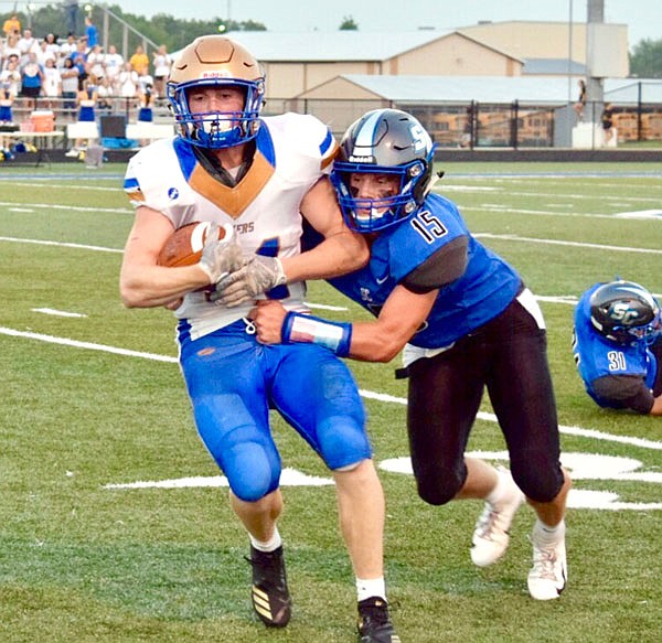 South Callaway free safety Peyton Leeper tries to take down a Lafayette County ball carrier during the Bulldogs' 41-20 loss to the Huskers last month in Mokane.