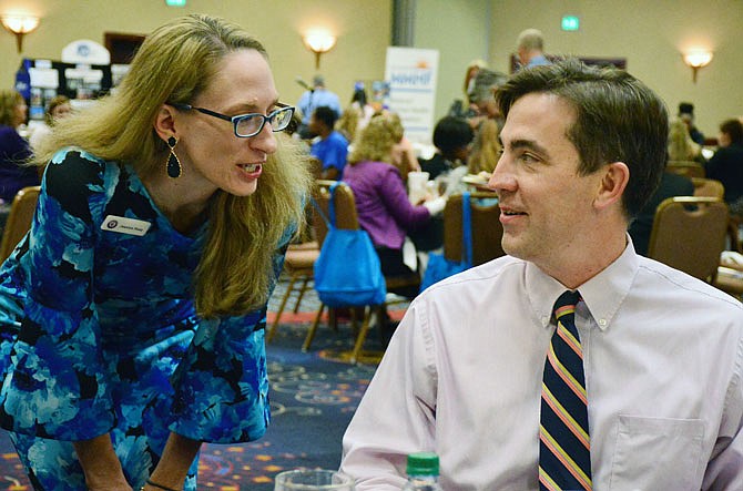 Rep. Jay Barnes and Missourians to End Poverty Chairperson Jessica Hoey talk Thursday during the Missouri Poverty Summit at the Capitol Plaza Hotel.