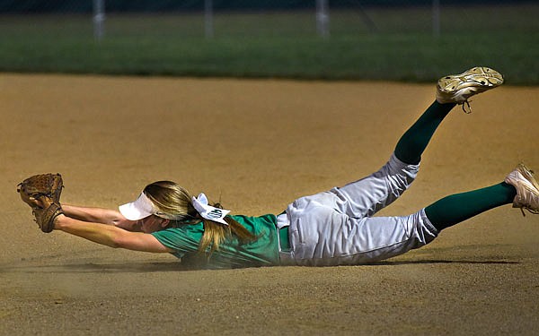 Natalie Otto of the Blair Oaks Lady Falcons dives to catch a ball during the third inning of Thursday night's game against the Jefferson City Lady Jays at the Falcon Athletic Complex. It was ruled the ball hit the ground on the play.