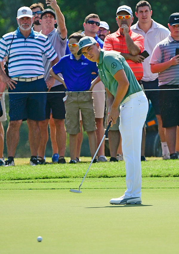 Rickie Fowler attempts a birdie putt on the second hole Thursday during the first round of the Tour Championship in Atlanta.