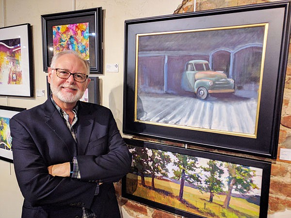 Mike Seat, an artist from Columbia, said he likes using contrasts in his work. His painting is part of the Art House's latest exhibit, "Hide and Seek."