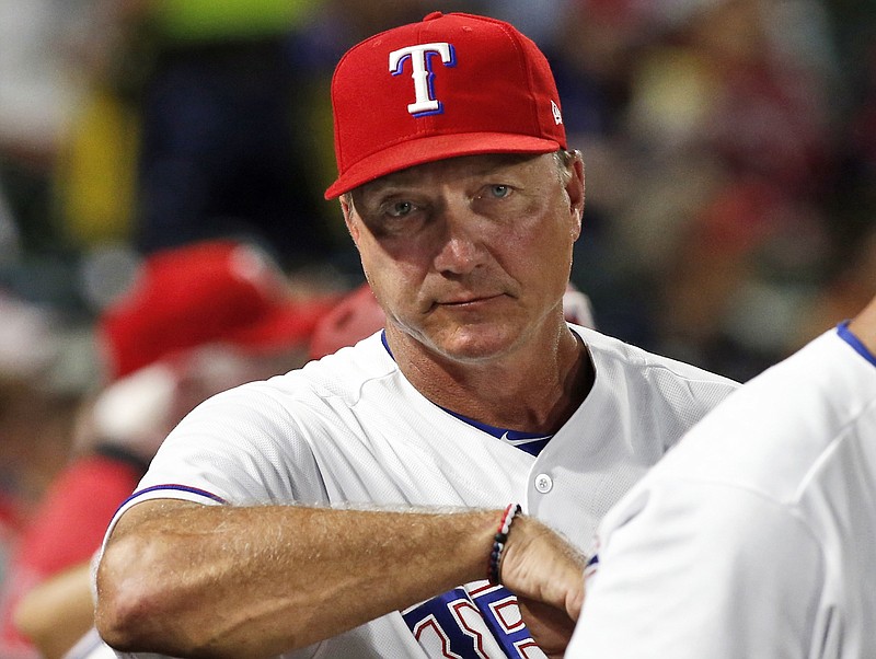 In this Tuesday, Sept. 18, 2018, file photo, Texas Rangers manager Jeff Banister watches from the dugout during the seventh inning of a baseball game against the Tampa Bay Rays in Arlington, Texas. The Rangers fired Banister on Friday, Sept. 21, 2018.  (AP Photo/Mike Stone, File)