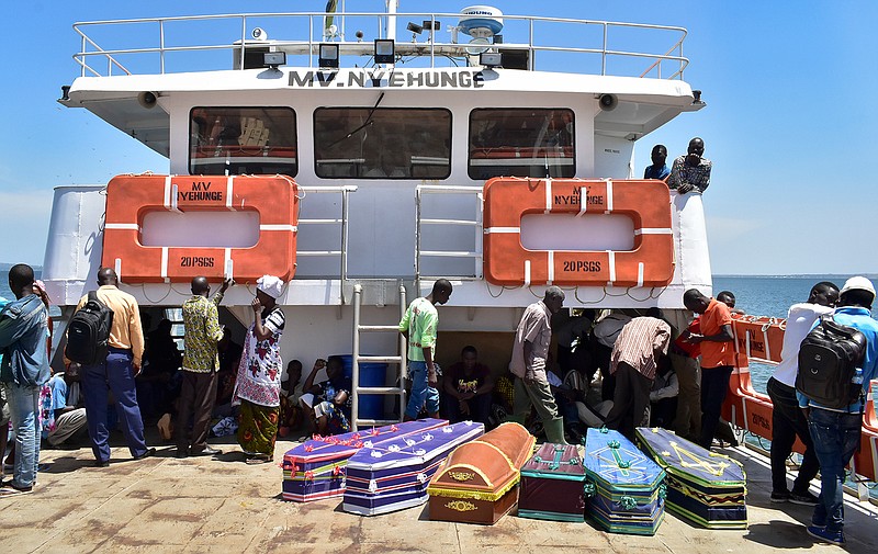 Coffins for the victims of the MV Nyerere passenger ferry are transported by another ferry to Ukara Island, Tanzania Saturday, Sept. 22, 2018. The death toll soared past 200 on Saturday while officials said a survivor was found inside the capsized ferry and search efforts were ending to focus on identifying bodies, two days after the Lake Victoria disaster. (AP Photo)