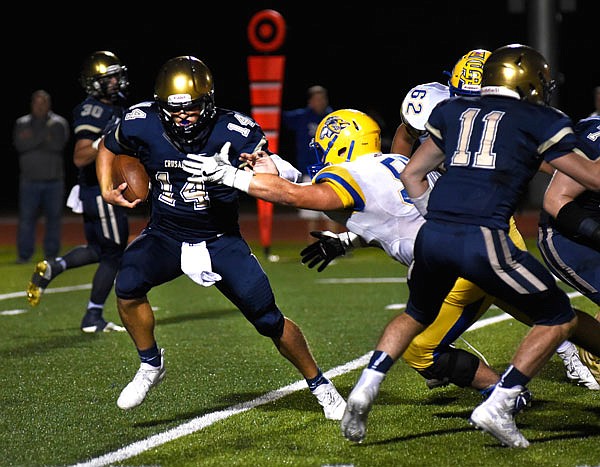 Helias quarterback Jacob Weaver runs the ball during Friday's game against St. Francis Borgia at the Crusaders Athletic Complex.