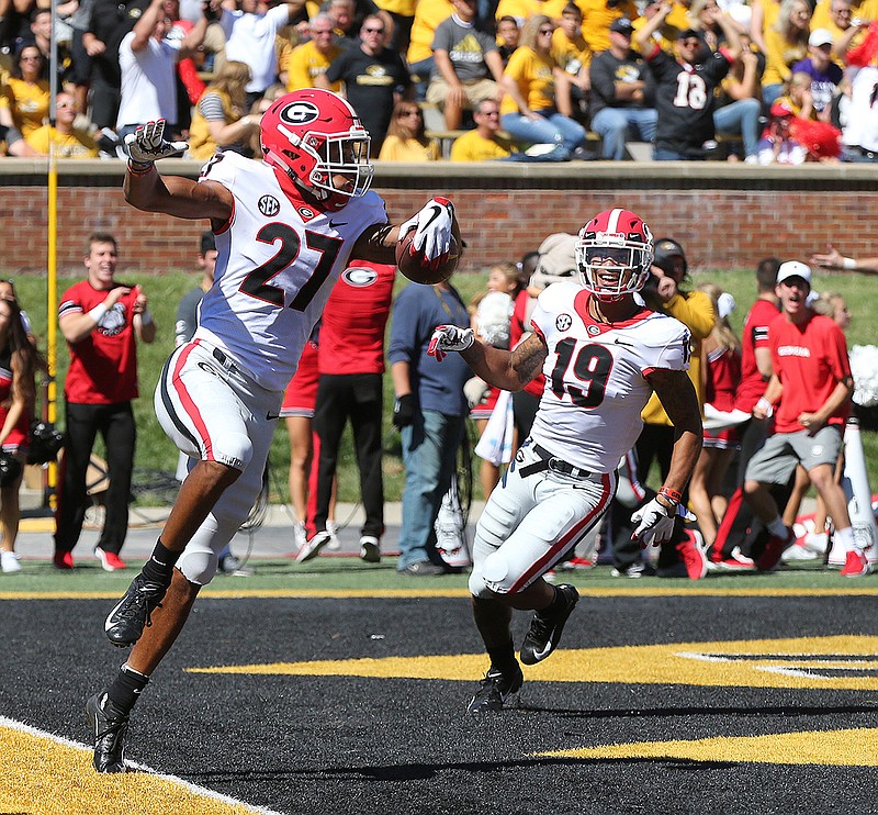 Georgia defensive back Eric Stokes celebrates after he returned a blocked a punt for a touchdown during the first half  of an NCAA college football game against Missouri, Saturday, Sept 22, 2018, in Columbia, Mo. (Curtis Compton/Atlanta Journal-Constitution via AP)