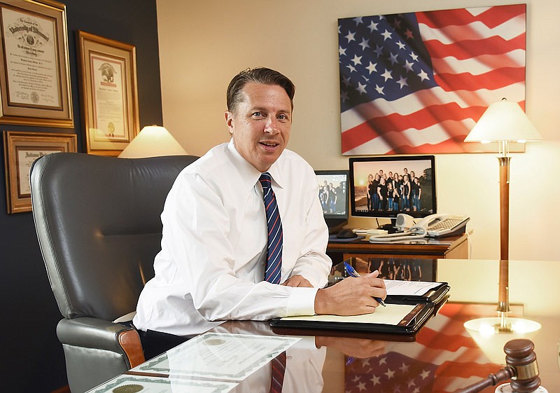 Cotton Walker poses at his desk in this Sept. 7, 2018, photo.