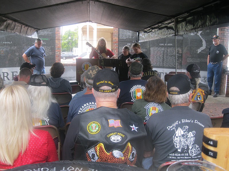 About 50 local and area military veterans gather Saturday at downtown Texarkana's Korea-Vietnam Memorial for the 31st annual POW-MIA Vigil. The vigil ended with a final candlelight service.