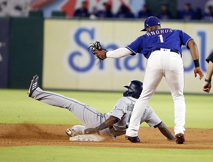 Seattle Mariners' Guillermo Heredia (5) is tagged out by Texas Rangers shortstop Elvis Andrus (1) at second base to complete a double play during the third inning of a baseball game Saturday, Sept. 22, 2018, in Arlington, Texas. (AP Photo/Michael Ainsworth)