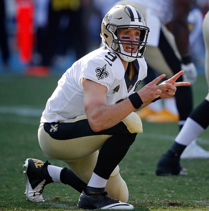 In this Aug. 25, 2018, file photo, New Orleans Saints quarterback Drew Brees motions before starting a play during the first half of an NFL preseason football game against the Los Angeles Chargers, in Carson, Calif. The Atlanta Falcons may be a step ahead of the New Orleans Saints in each team's search for offensive balance. That's not enough to make Falcons defensive coordinator Marquand Manuel rest easy. The Saints have Drew Brees, and the veteran quarterback's guile is enough to make any defensive coach lose sleep. (AP Photo/Jae C. Hong, File)