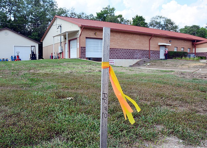 Stakes indicate where a new addition will be built Thursday at the Samaritan Center on East McCarty Street.