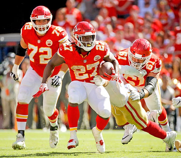 Chiefs running back Kareem Hunt runs the ball during the second half of Sunday afternoon's game against the 49ers at Arrowhead Stadium in Kansas City.