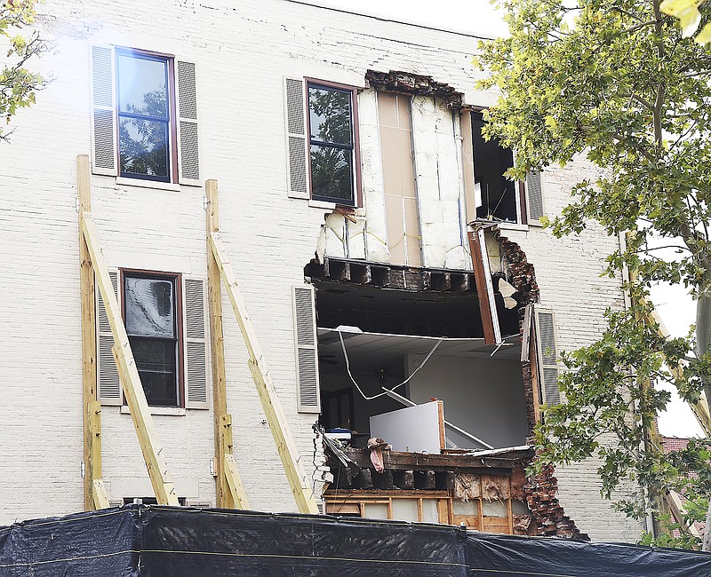More of the brick wall of the third floor of the building located at Madison and High streets fell to the ground Monday morning. 