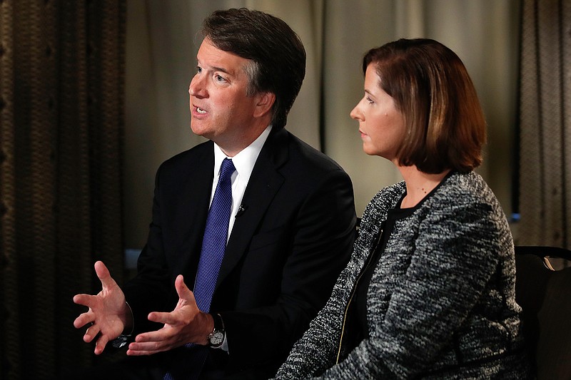 Supreme Court nominee Brett Kavanaugh, with his wife, Ashley Estes Kavanaugh, answers questions Monday during a FOX News interview in Washington about allegations of sexual misconduct.