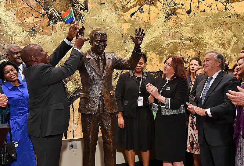 South Africa President Cyril Ramaphosa, left, United Nations General Assembly President Maria Fernanda Espinosa, center, and United Nations Secretary General Antonio Guterres attend the unveiling ceremony Monday of the Nelson Mandela Statue, which was presented as a gift from the Republic of South Africa, at United Nations headquarters in New York.