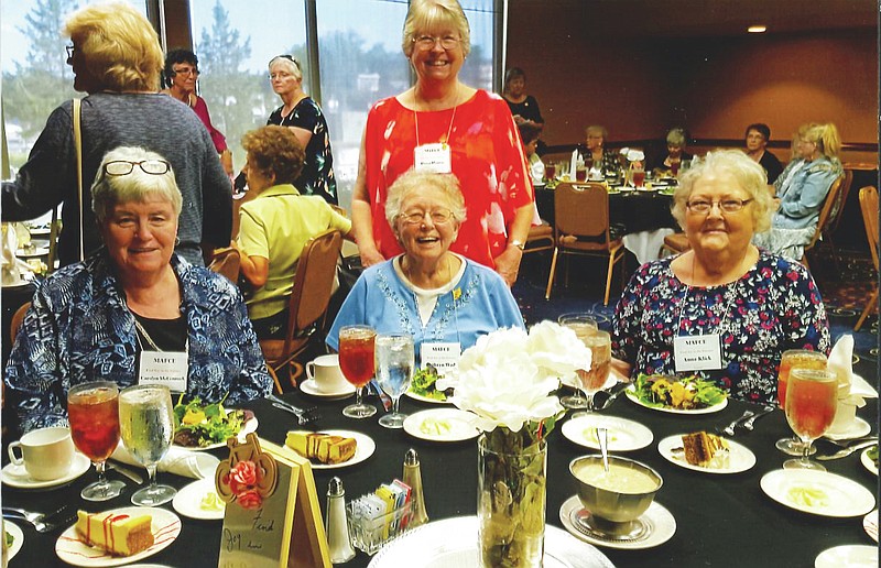 Carolyn McCormack (left), Kathryn Wade and Anna Klick seated, and Dana Harris (standing) at the MAFCE 2018 annual conference. 