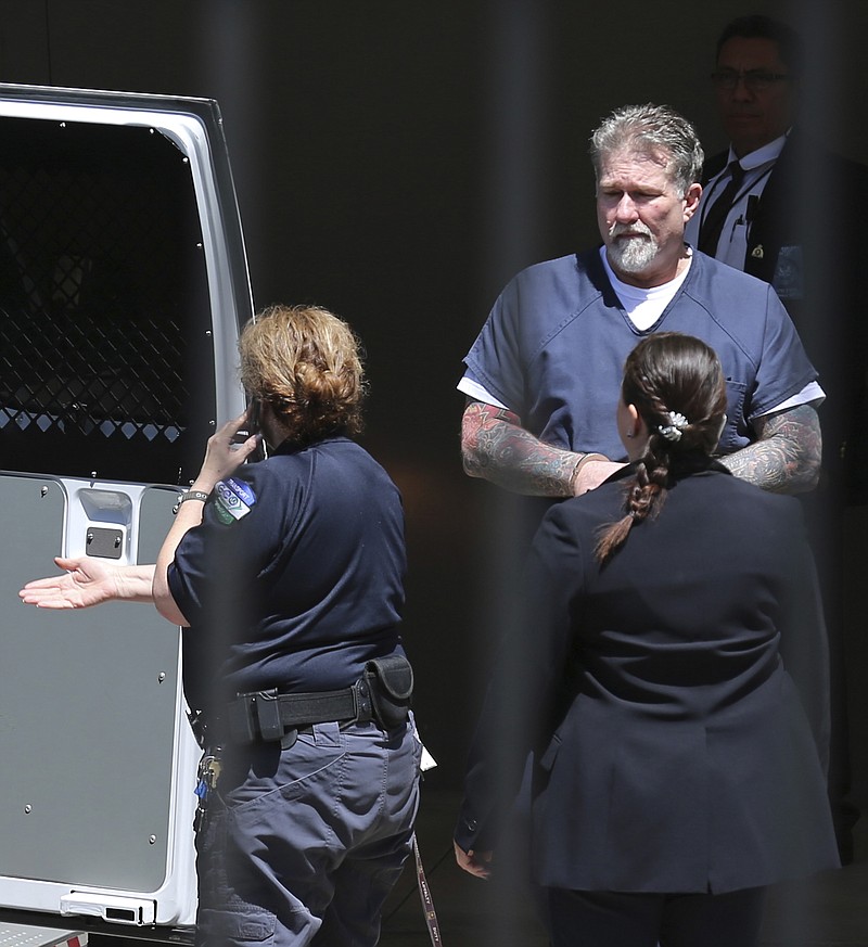 This May 17, 2018, file photo shows John Xavier Portillo, former national vice president of the Bandidos, leaving John Wood Federal Courthouse in San Antonio, Texas. On Monday, Sept. 24, 2018, a federal judge has sentenced Portillo to two consecutive life terms and another 20 years in prison for directing a violent racketeering and drug trafficking enterprise. (Kin Man Hui/The San Antonio Express-News via AP)