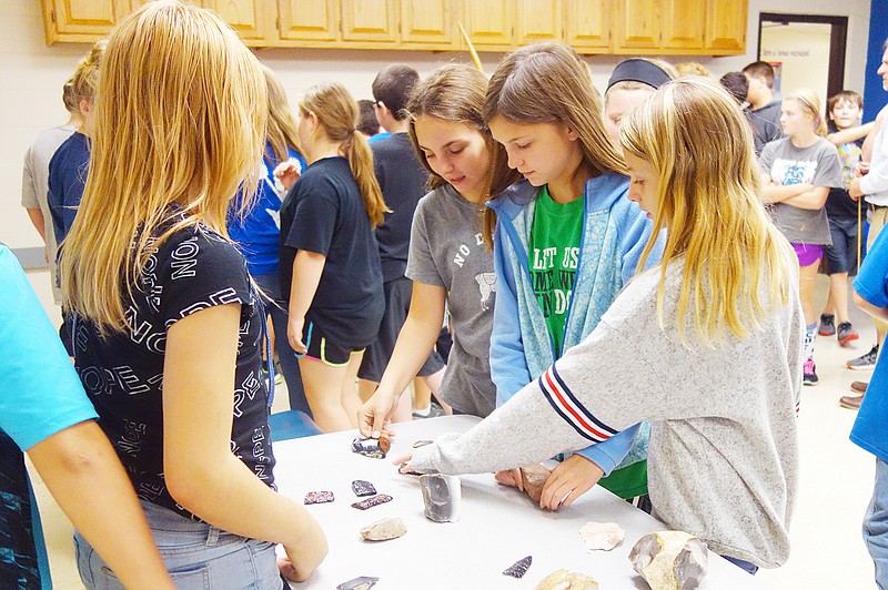 South Callaway Middle School sixth-graders learned about flint-knapping and other ancient Native American tool-making techniques Monday. Flint-knapping is a process of methodically chipping away flakes of stone to shape a sharp knife, arrowhead or similar object.