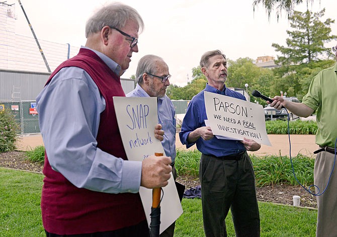 From left, Tom White, Jim McConnell and David Clohessy speak to the media Wednesday outside the Capitol. Clohessy and members of SNAP presented a letter to Gov. Mike Parson asking him to use subpoena power and command a criminal investigation in alleged sexual abuse by Catholic Church officials.