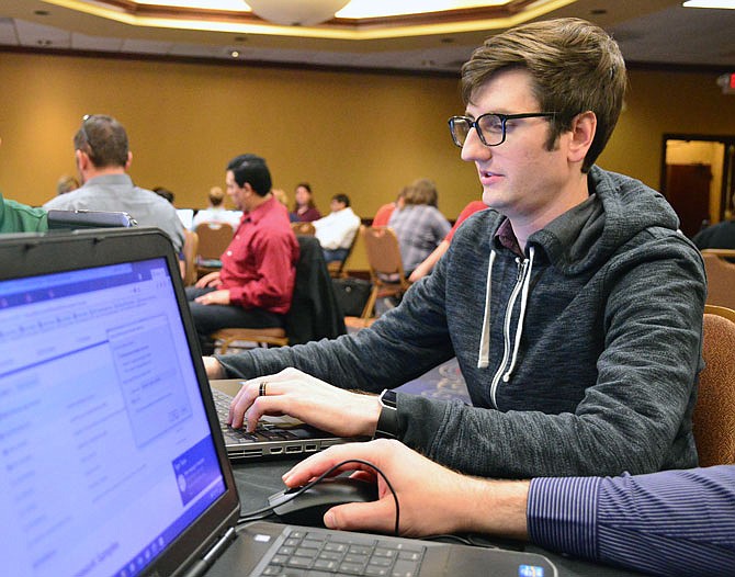 Tyler Heinrich competes in a "hackathon" Wednesday at the Capitol Plaza Hotel. IT specialists from the Missouri Office of Administration were wrapping up a two-day training seminar.