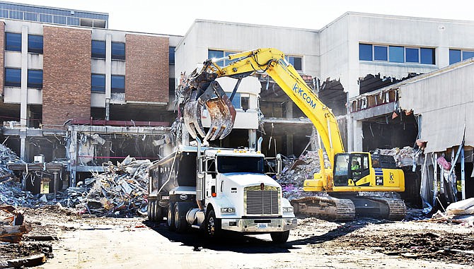 SEPTEMBER 2018 FILE: Demolition of the old St. Mary's Health Center continues as heavy equipment operators from Kcom Environmental of Fort Wayne, Indiana, pull down exterior walls and flooring, section by section, salvaging what can be recycled. The work seen here is on the Bolivar Street side of the old hospital. 