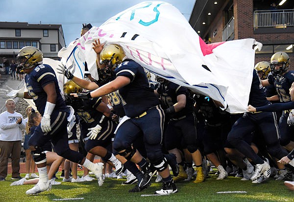 The Helias Crusaders take the field prior to last Friday night's game against the Borgia Knights at Ray Hentges Stadium.