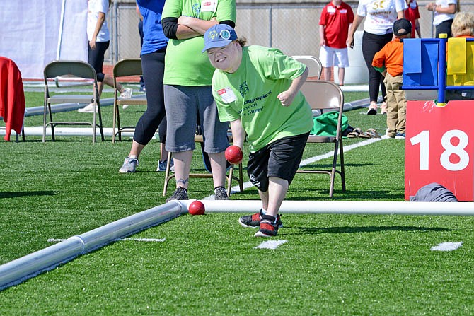 Brett Nelson, playing for a team from Lee's Summit, tosses a bocce ball Friday during the State Outdoor Games at Blair Oaks Athletic Complex.